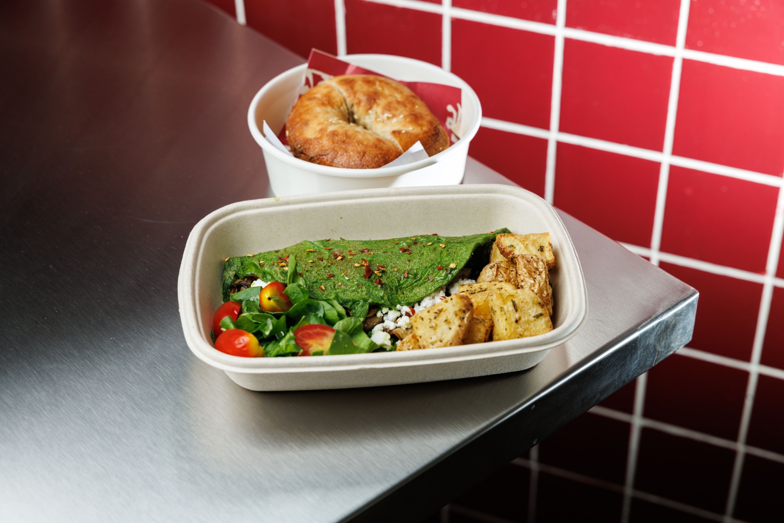 Green Morning Omelette — spinach omelette, cottage cheese mushroom filling, pepperoncini, arugula
tomato salad, roasted potato, served with sour...