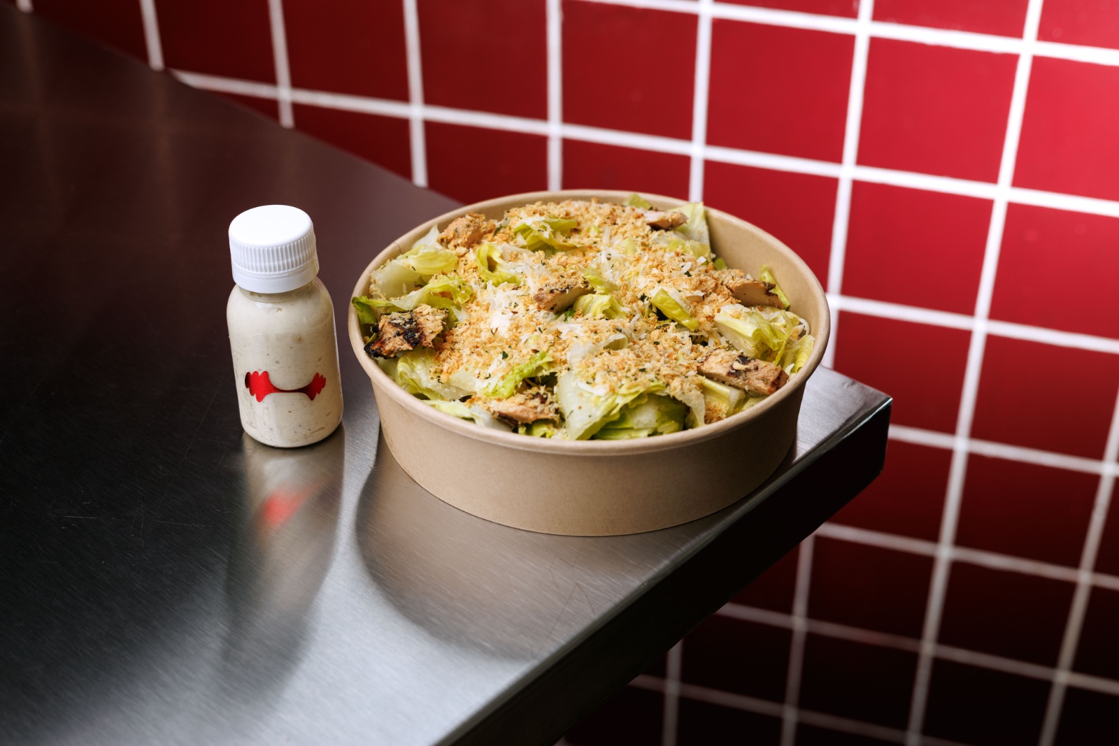 Light Chicken Caesar — romaine lettuce, grilled chicken, crunchy gremolata, parmesan, light caesar dressing