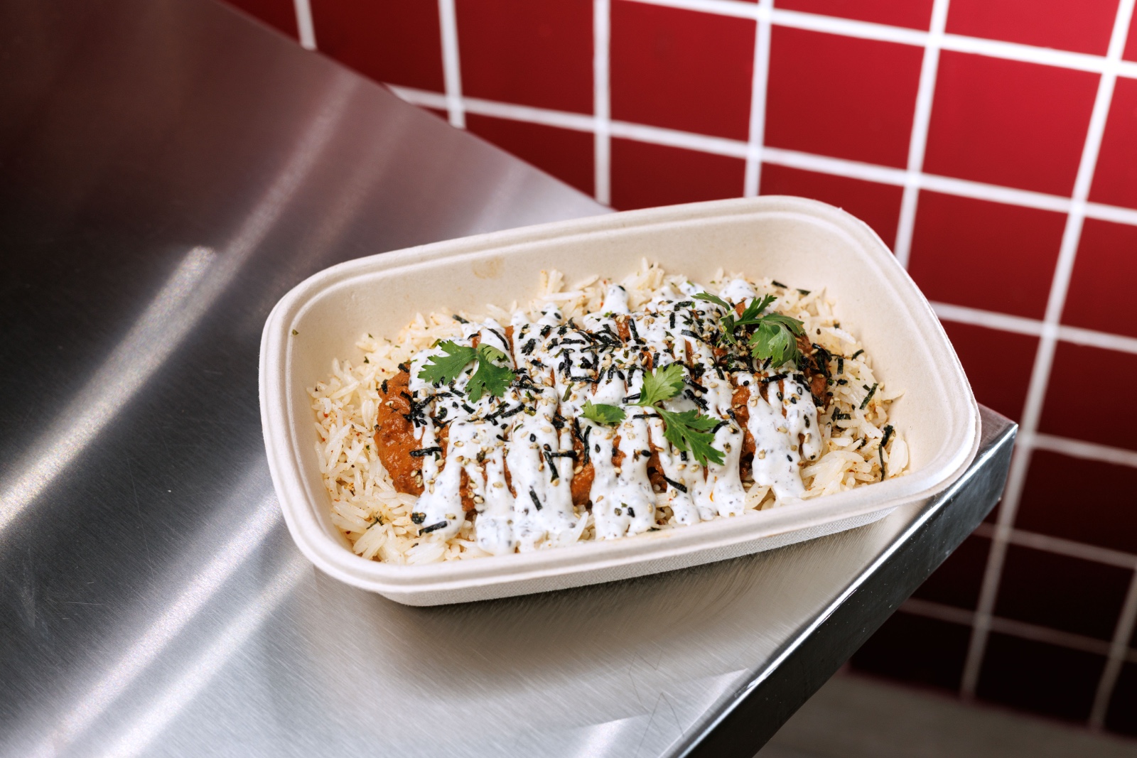 Tan Tan Don — togarashi rice, seasoned ground beef , tomato sauce ,light truffle mayo, furikake, coriander.