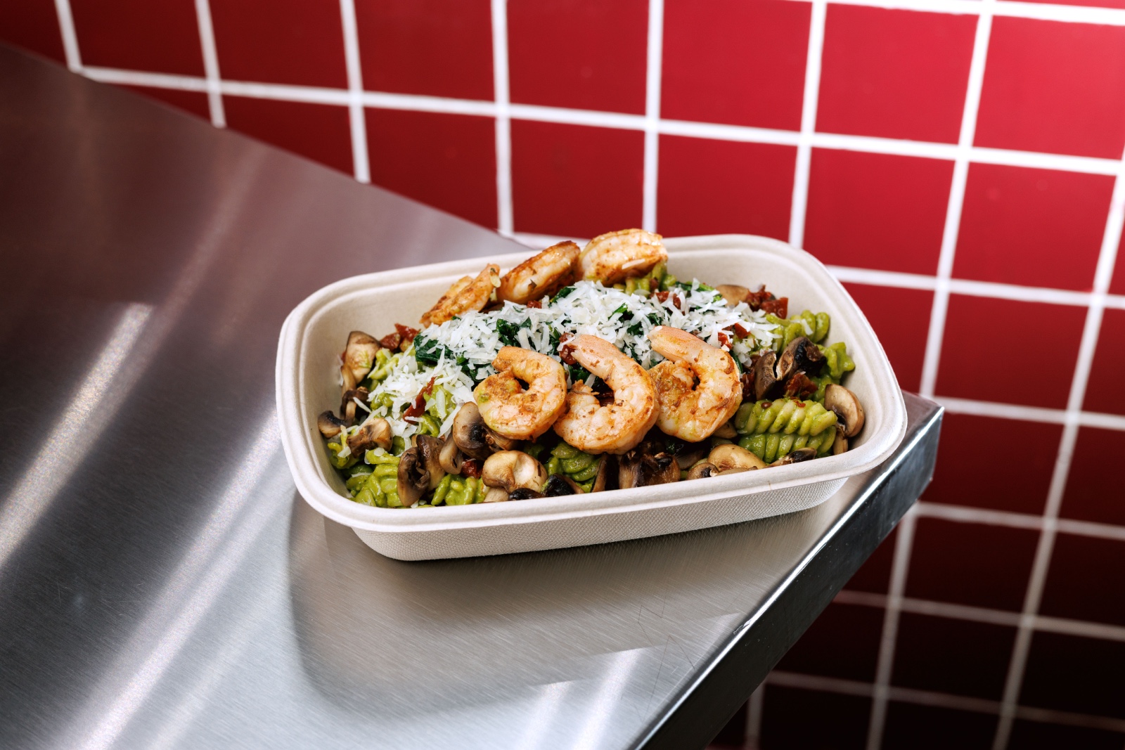 Green Machine Pasta — fusilli pasta , basil spinach puree , grilled shrimps , mushrooms, sundried tomato, suteed spinach , roasted peppers, pa...