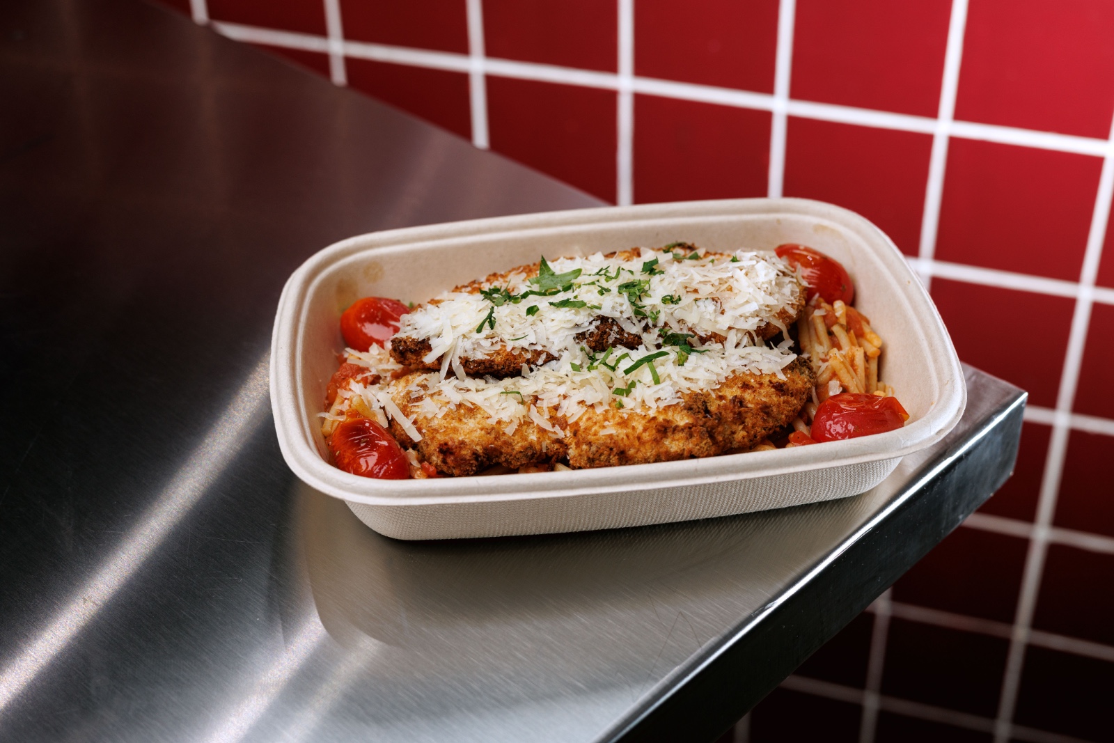 Chicken Milanese — air fried breaded chicken breast, GF pasta, tomato sauce, parmesan