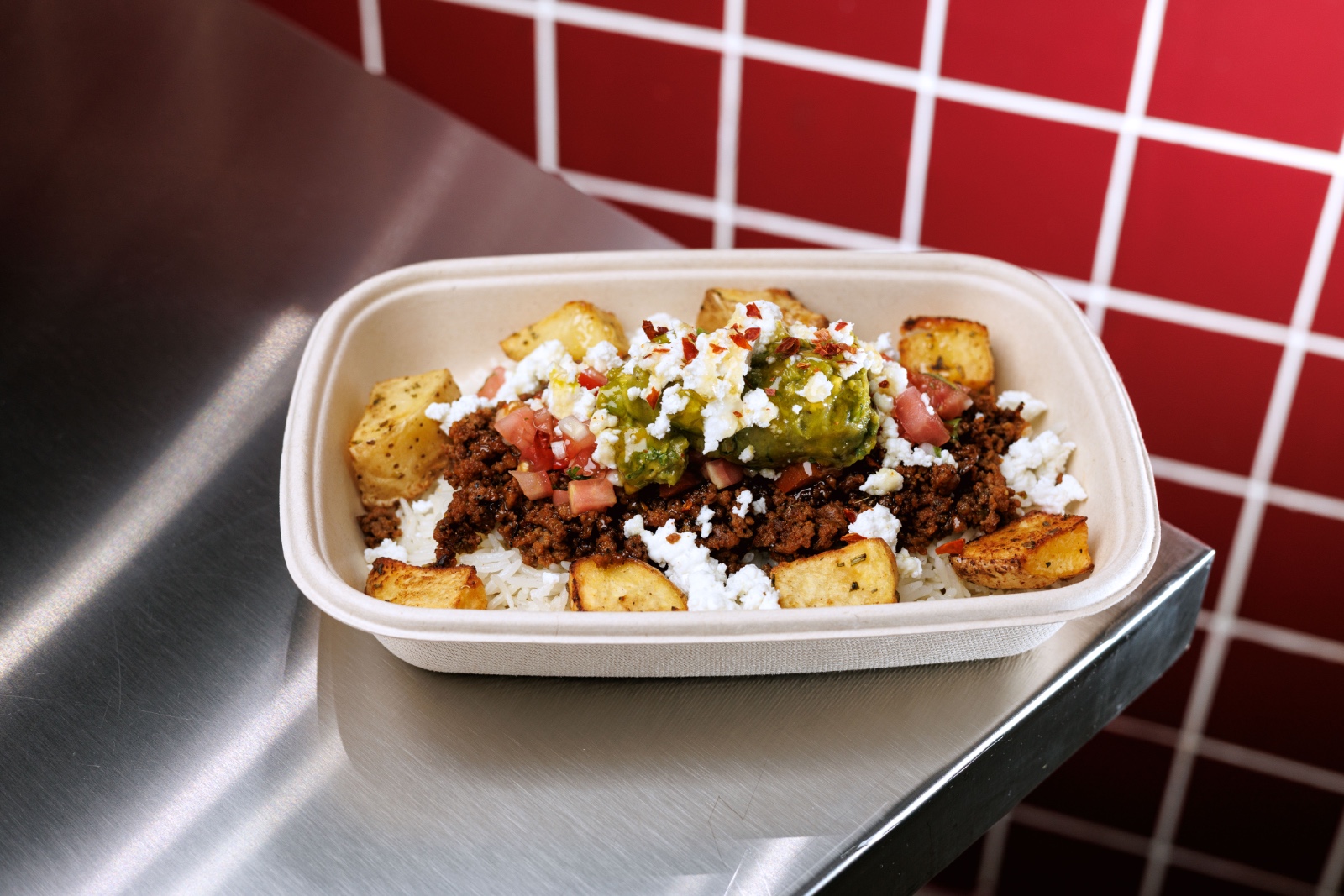 Beef Taco Bowl — white rice , Mexican seasoned ground beef , roasted potato , cottage cheese , guacamole , pico de Gallo , pepperoncini ,...