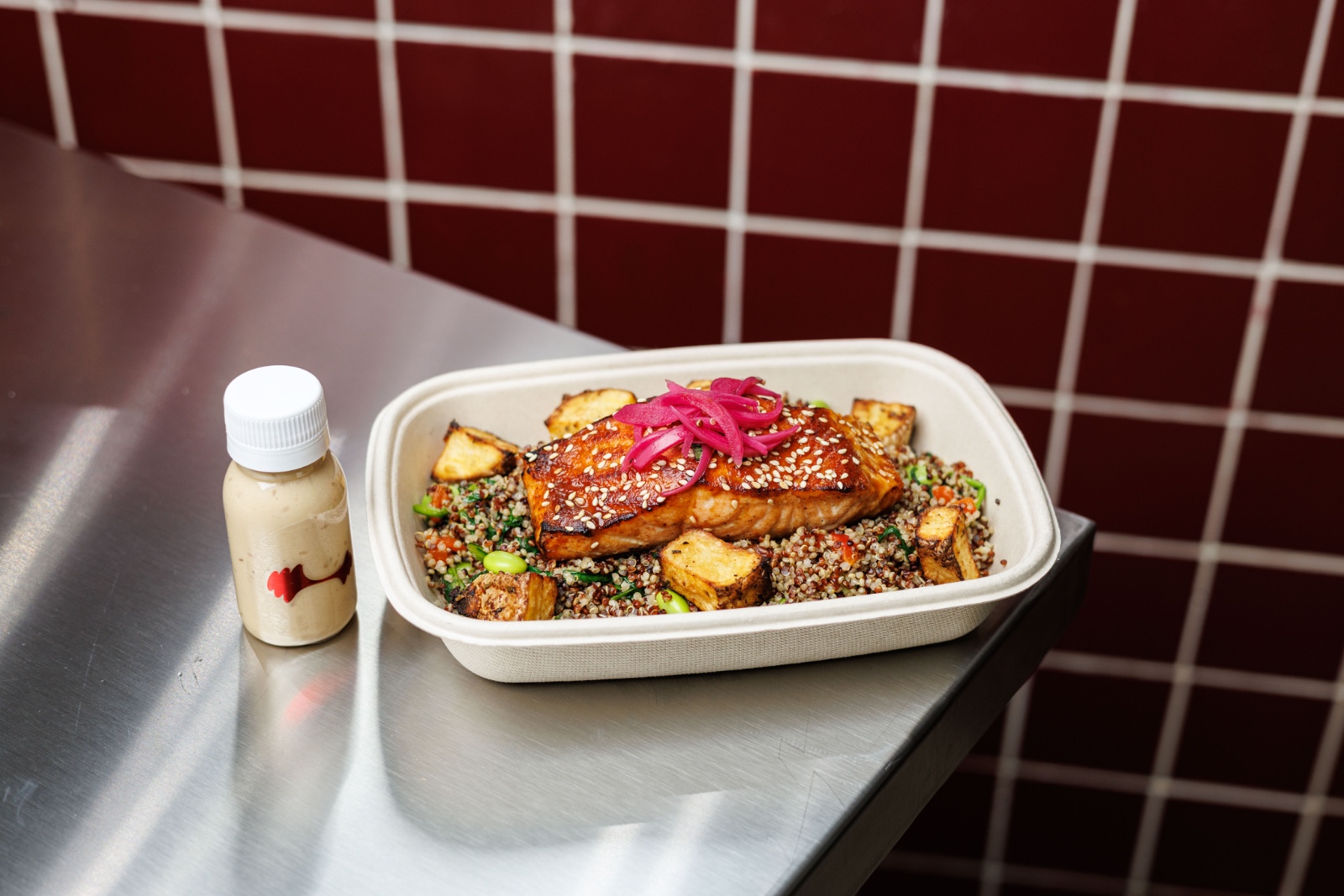 Fitness Black Tiger — miso glazed grilled salmon, quinoa, edamame, roasted red pepper, pickled onion, roasted potato, honey miso sauce