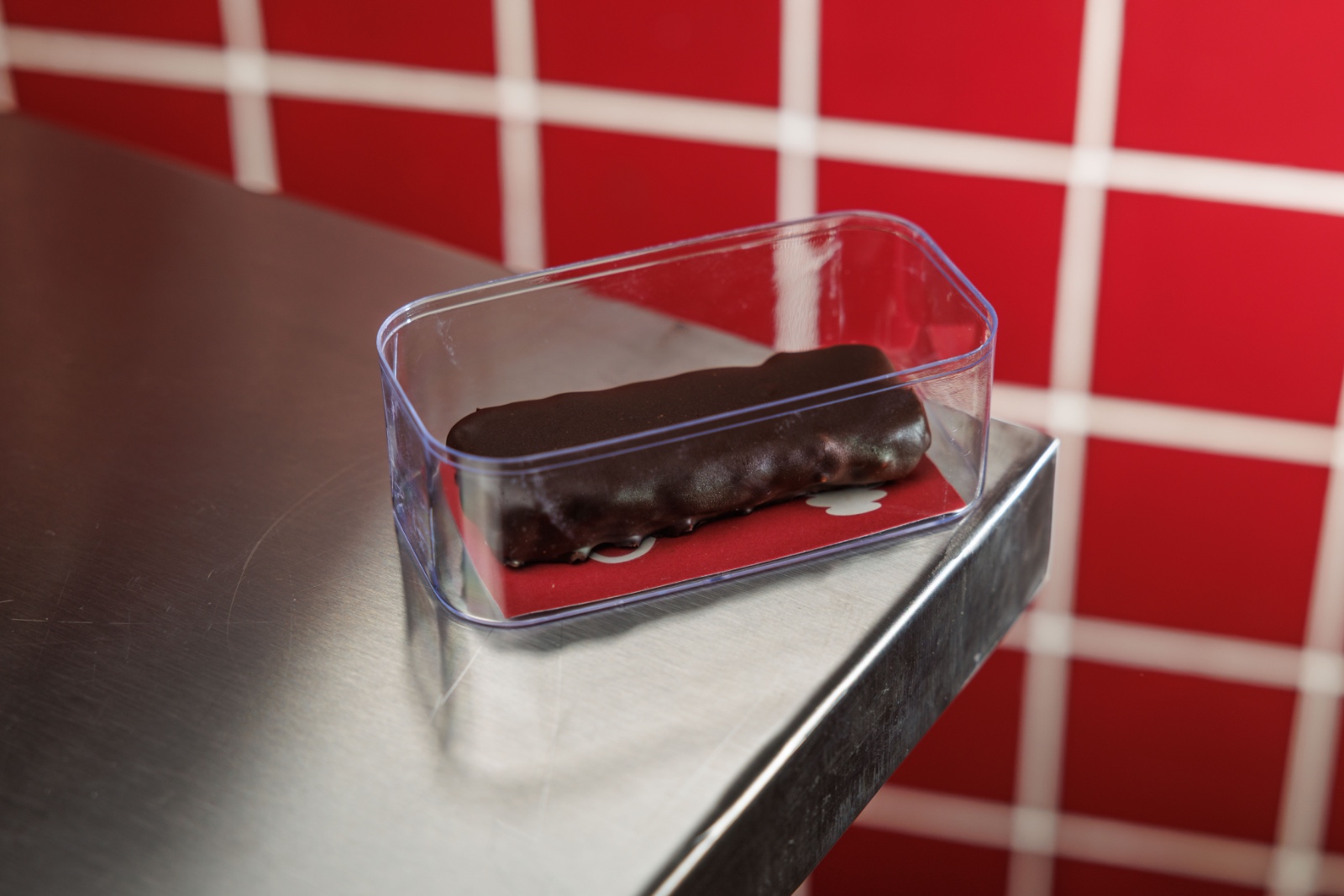Bounty Bar — coconut shreds , coconut oil , milk , dipped in dark chocolate .
